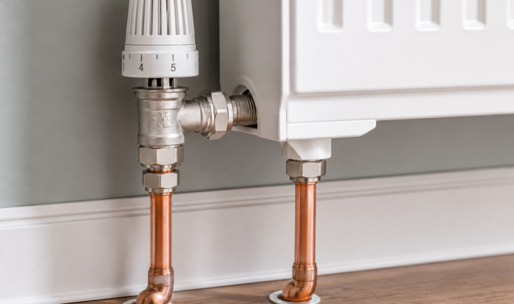 a_close_up_indoor_scene_of_plumbing_under_a_radiat_8_batch_8